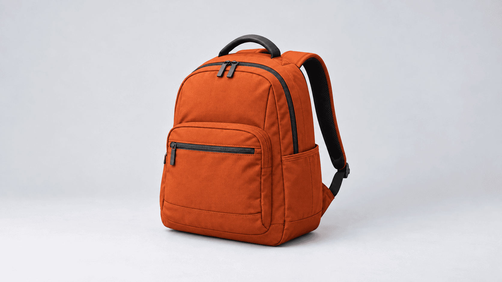 Backpack stitching and handle details fully visible in a wide frame