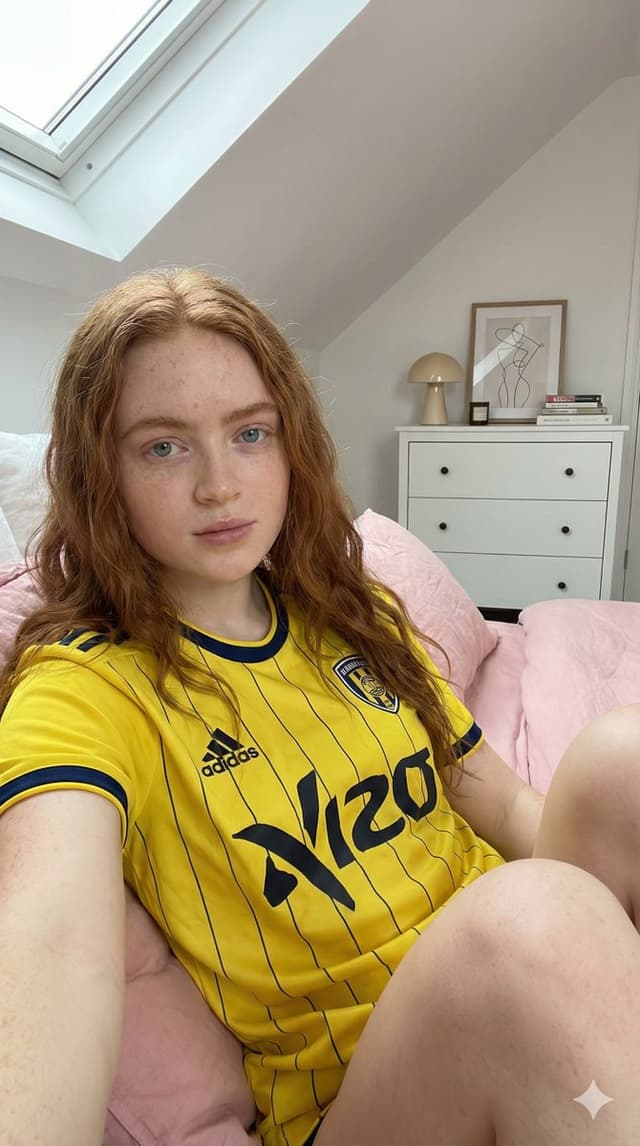 Photorealistic Selfie of Sadie Sink in a Soccer Jersey — output