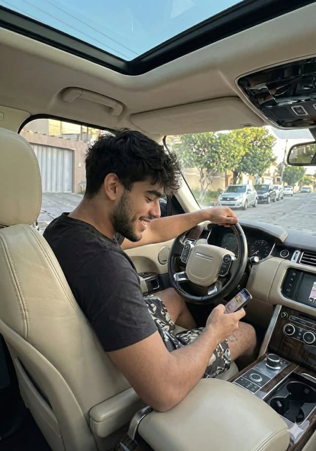 Casual Young Man in Luxury Car Interior — output