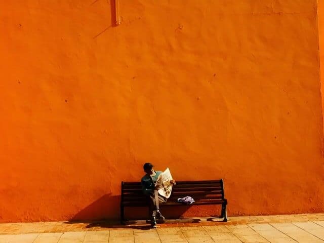Man Tying Shoe and Walking Away — cover