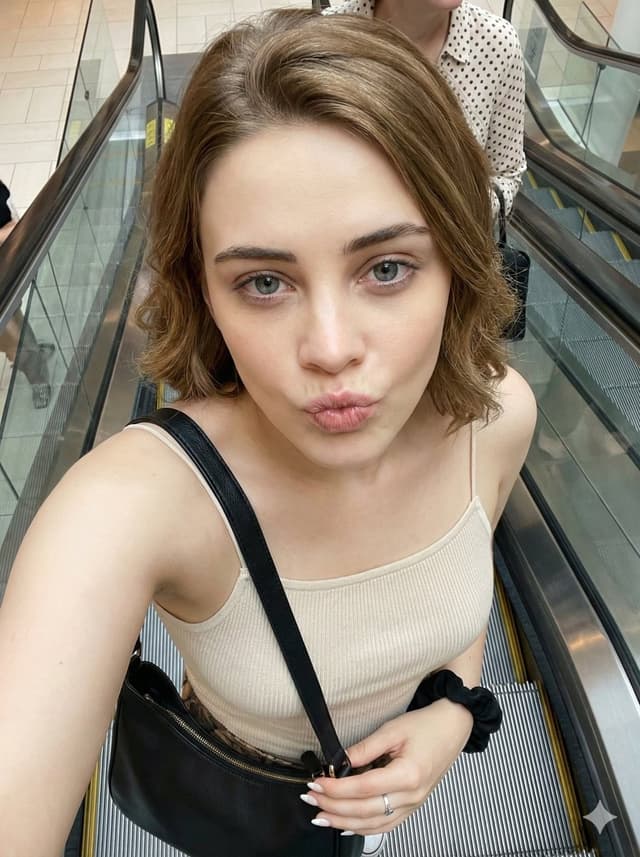 Profile / Avatar - Candid Selfie Prompt with Duck Face Expression on Escalator — output