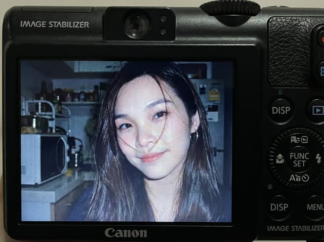 Compact Digital Camera Screen Snapshot of a Young Woman — output