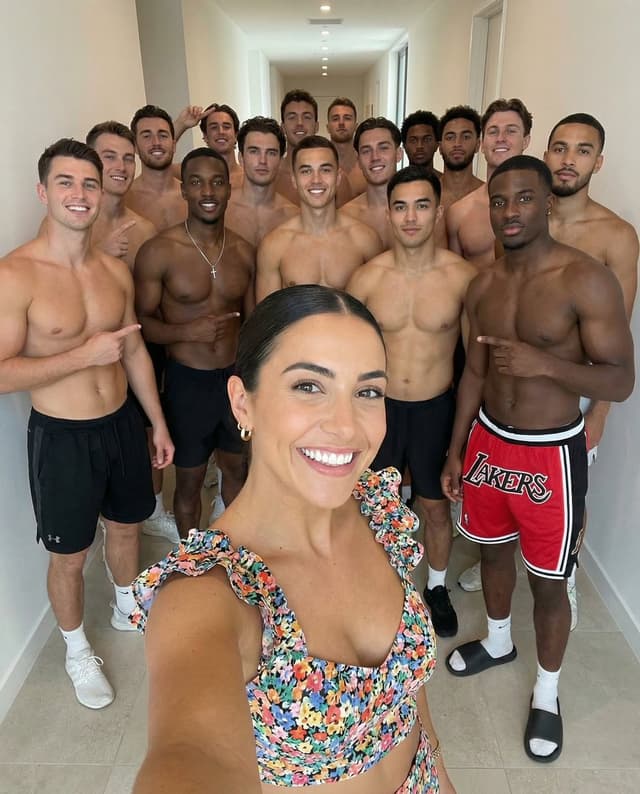 Social Media Post - High-Angle Selfie with Group of Shirtless Men — output