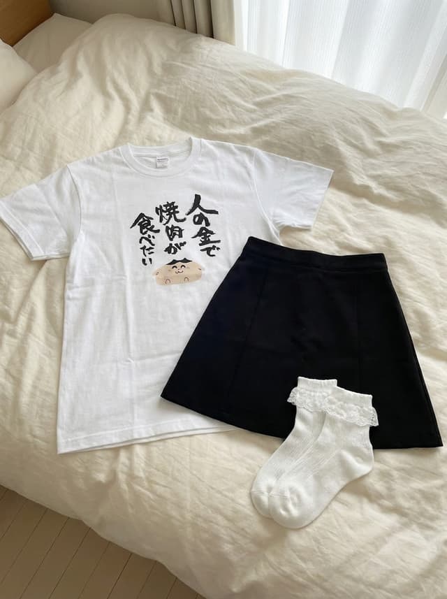 Clothing separated on the bed — output
