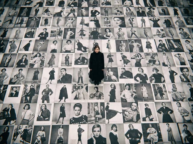 Bird's-Eye View of Actress on Billboard-Covered Ground — output