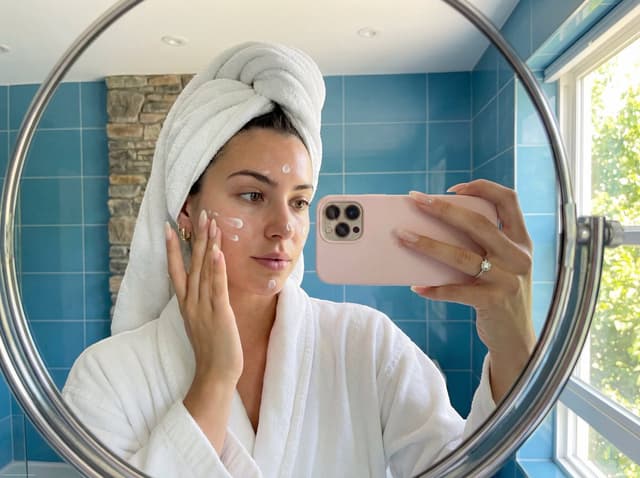 Skincare Mirror Selfie in a Modern Bathroom — output