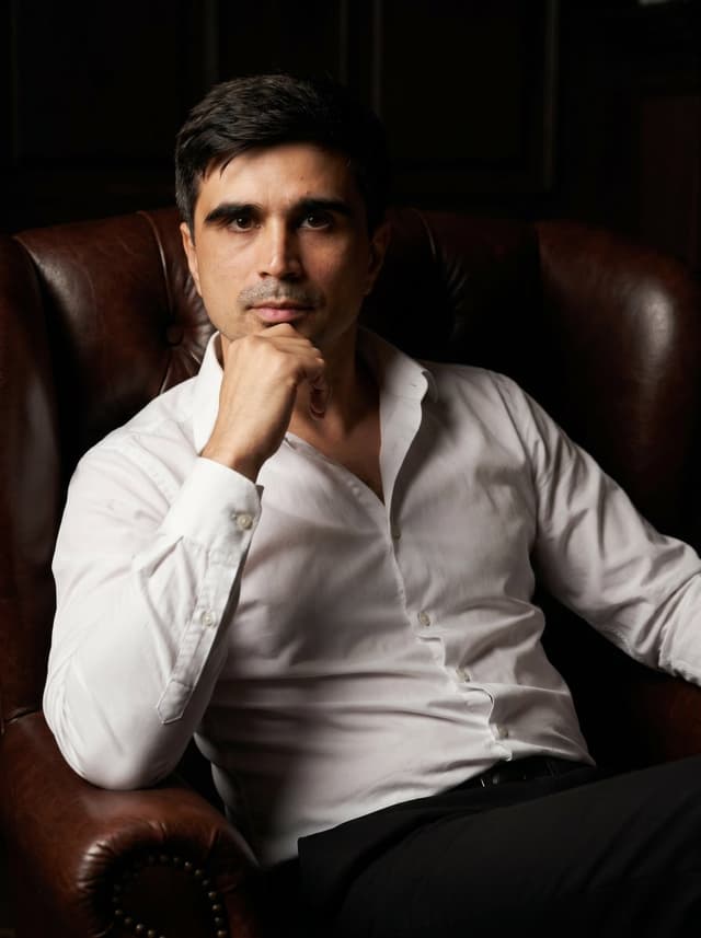 Profile / Avatar - Professional Executive Portrait in Armchair — output
