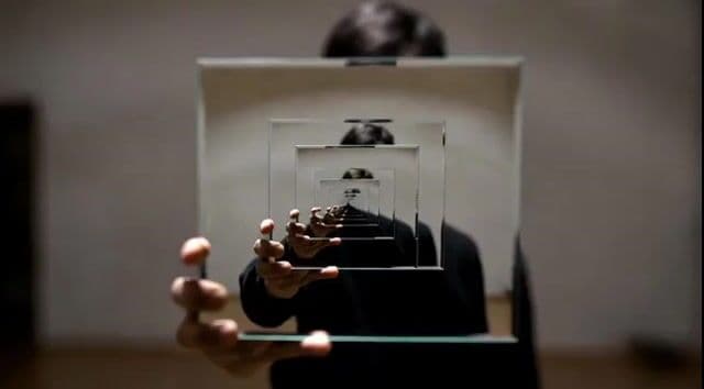 Video prompt for a person holding a mirror to show reflections — cover