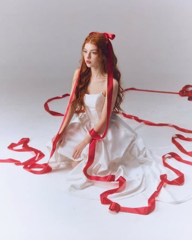 Fine-Art Studio Portrait with Red Ribbons — output