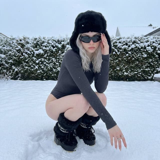 Winter Editorial Low-Angle Squat Pose Prompt (iPhone Style) — output